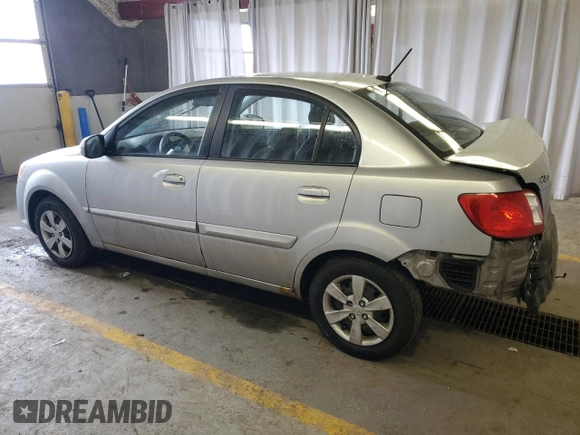 2010 Kia Rio LX with VIN KNADH4A34A6643716, listed as a Copart auction lot 46880375 with 112,265 mi miles and Salvage Title. Bid and sale history available at carsss.com. Image 2.