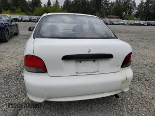 1999 Hyundai Accent z VIN KMHVD14N9XU503210, wystawiony jako Copart lot #56486325 z przebiegiem 195 501 mil mil oraz Szkody całkowita. Historia ofert i sprzedaży dostępna na DreamBid. Obrazek 6.