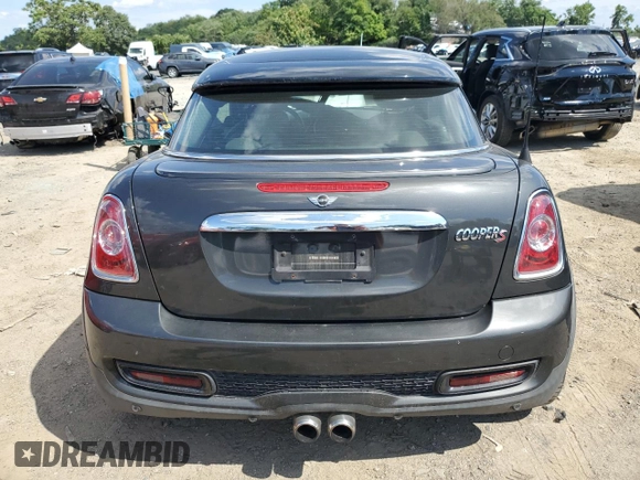 2015 MINI Coupe S z VIN WMWSX3C55FT409449, wystawiony jako Copart lot #66574174 z przebiegiem 99 155 mil mil oraz Szkody całkowita. Historia ofert i sprzedaży dostępna na DreamBid. Obrazek 6.