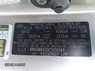 2012 Kia Optima Hybrid with VIN KNAGM4AD0C5016344, listed as a IAAI auction lot 41609544 with 149,986 mi miles. Bid and sale history available at carsss.com. Image 9.