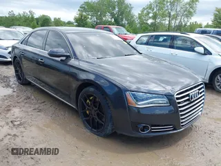 2011 Audi A8 with VIN WAURVAFDXBN020316, listed as a IAAI auction lot 42297622 with 156,881 mi miles and . Bid and sale history available at DreamBid. Image 1.