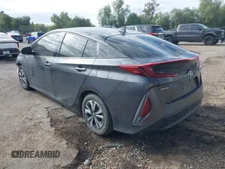 2018 Toyota Prius Plus with VIN JTDKARFPXJ3104302, listed as a IAAI auction lot 42127312 with 87,531 mi miles and . Bid and sale history available at DreamBid. Image 3.
