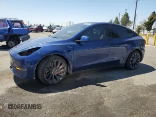 2021 Tesla Model Y Performance z VIN 5YJYGDEF0MF157795, wystawiony jako Copart lot #57163245 z przebiegiem 62 598 mil mil oraz Szkoda całkowita • Salvage title. Historia ofert i sprzedaży dostępna na DreamBid. Obrazek 1.