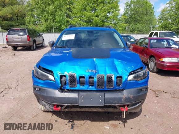 2020 Jeep Cherokee Trailhawk with VIN 1C4PJMBXXLD636547, listed as a IAAI auction lot 42314654 with 59,061 mi miles and . Bid and sale history available at DreamBid. Image 12.