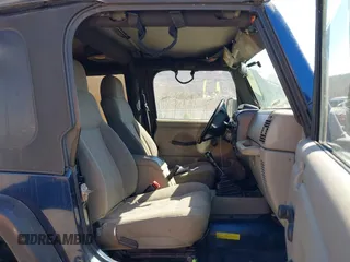 2003 Jeep Wrangler Sport with VIN 1J4FA49S03P343285, listed as a IAAI auction lot 41823684 with 201,723 mi miles and . Bid and sale history available at DreamBid. Image 5.