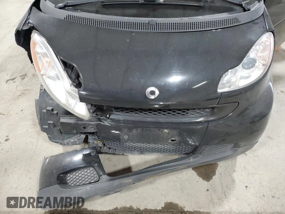 2011 Smart fortwo Pure с VIN WMEEJ3BA5BK480412, выставлен на аукционе Copart как лот 87023194 с пробегом 70 496 миль миль и Списание • Salvage title. История ставок и продаж доступна на DreamBid. Изображение 11.