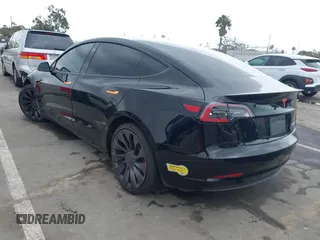 2022 Tesla Model 3 Performance with VIN 5YJ3E1EC3NF248534, listed as a IAAI auction lot 41882694 with 55,415 mi miles and . Bid and sale history available at carsss.com. Image 3.