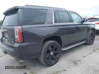 2015 GMC Yukon SLT with VIN 1GKS1BKC6FR245564, listed as a IAAI auction lot 42139295 with 149,088 mi miles. Bid and sale history available at carsss.com. Image 4.