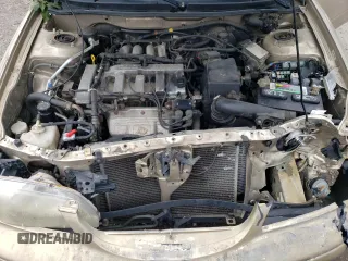 1998 Mazda 626 DX with VIN 1YVGF22CXW5733338, listed as a Copart auction lot 71796184 with 196,218 mi miles and Salvage Title. Bid and sale history available at carsss.com. Image 13.