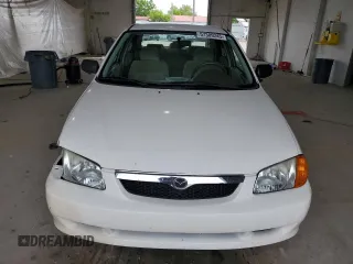 1999 Mazda Protege DX z VIN JM1BJ2224X0173126, wystawiony jako Copart lot #57389245 z przebiegiem 155 534 mil mil oraz Szkoda całkowita • Salvage title. Historia ofert i sprzedaży dostępna na DreamBid. Obrazek 5.