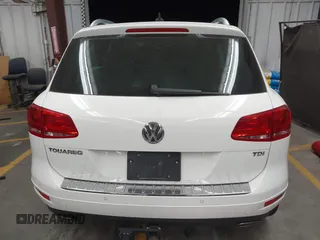 2012 Volkswagen Touareg Sport with VIN WVGFK9BP2CD002991, listed as a IAAI auction lot 42077523 with 94,515 mi miles and . Bid and sale history available at DreamBid. Image 16.