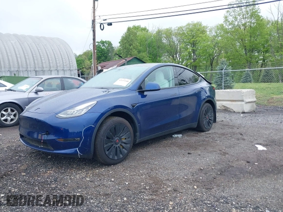 2023 Tesla Model Y Long Range z VIN 7SAYGDEE6PF603981, wystawiony jako IAAI lot #42133348 z przebiegiem 28 566 mil mil oraz . Historia ofert i sprzedaży dostępna na DreamBid. Obrazek 18.