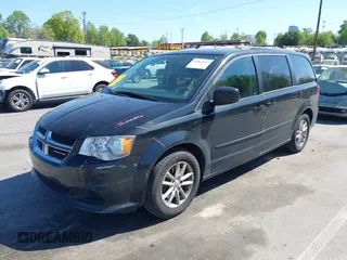 2014 Dodge Grand Caravan SXT with VIN 2C4RDGCG4ER341699, listed as a IAAI auction lot 42064523 with 234,422 mi miles and . Bid and sale history available at DreamBid. Image 2.