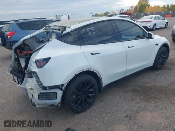 2021 Tesla Model Y Long Range with VIN 5YJYGDEE2MF074246, listed as a IAAI auction lot 40456971 with 94,527 mi miles. Bid and sale history available at carsss.com. Image 4.