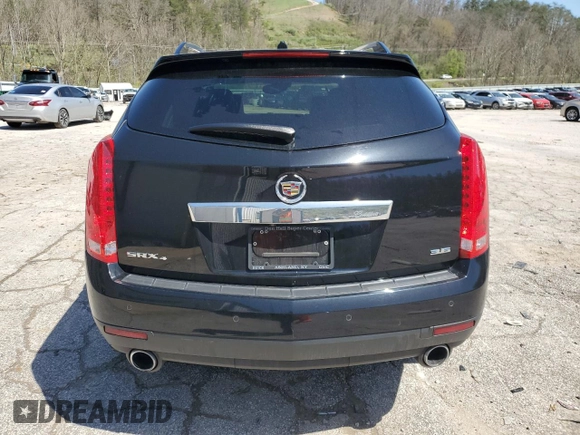 2014 Cadillac SRX Luxury Collection z VIN 3GYFNEE32ES647165, wystawiony jako Copart lot #52331335 z przebiegiem 27 277 mil mil oraz Szkoda całkowita • Salvage title. Historia ofert i sprzedaży dostępna na DreamBid. Obrazek 6.