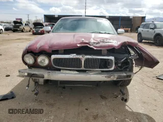 1998 Jaguar XJ Vanden Plas with VIN SAJKX6245WC830912, listed as a Copart auction lot 49717285 with 127,509 mi miles and Salvage Title. Bid and sale history available at DreamBid. Image 5.