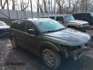 2018 Dodge Journey SE with VIN 3C4PDCABXJT496661, listed as a IAAI auction lot 41908124 with 82,257 mi miles. Bid and sale history available at carsss.com. Image 1.