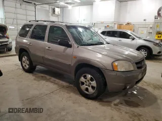 2001 Mazda Tribute LX with VIN 4F2CU08101KM05943, listed as a Copart auction lot 84077694 with 137,937 mi miles and Salvage Title. Bid and sale history available at DreamBid. Image 4.