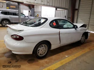 1997 Hyundai Tiburon with VIN KMHJG24M6VU052589, listed as a Copart auction lot 45118235 with 90,609 mi miles and Salvage Title. Bid and sale history available at carsss.com. Image 3.