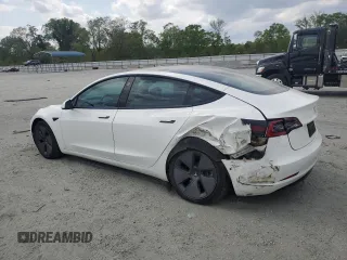 2021 Tesla Model 3 Standard Range Plus z VIN 5YJ3E1EAXMF973450, wystawiony jako Copart lot #52766645 z przebiegiem 66 827 mil mil oraz Szkoda całkowita • Salvage title. Historia ofert i sprzedaży dostępna na DreamBid. Obrazek 2.