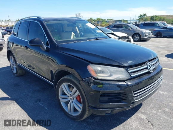 2013 Volkswagen Touareg Lux with VIN WVGEF9BP6DD004454, listed as a IAAI auction lot 41862958 with 239,548 mi miles and . Bid and sale history available at DreamBid. Image 6.