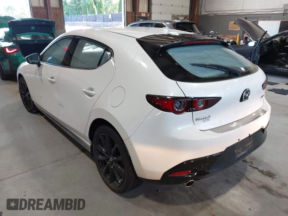 2021 Mazda 3 Premium with VIN JM1BPBML6M1348258, listed as a IAAI auction lot 42752477 with 35,285 mi miles and . Bid and sale history available at DreamBid. Image 3.