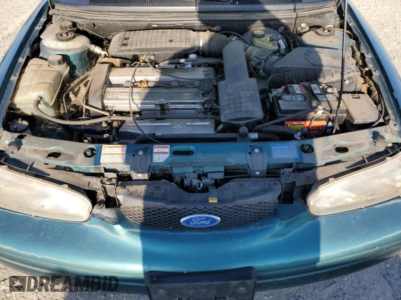 1997 Ford Contour z VIN 3FALP6536VM113346, wystawiony jako Copart lot #70036024 z przebiegiem 115 084 mil mil oraz Czysty tytuł • Clean title. Historia ofert i sprzedaży dostępna na DreamBid. Obrazek 11.