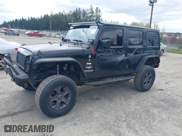 2014 Jeep Wrangler Unlimited Sahara with VIN 1C4BJWEG6EL107526, listed as a IAAI auction lot 42030244 with 69,077 mi miles. Bid and sale history available at carsss.com. Image 2.
