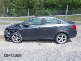 2016 Chevrolet Sonic LTZ z VIN 1G1JE5SB5G4137710, wystawiony jako IAAI lot #42131625 z przebiegiem 152 941 mil mil oraz . Historia ofert i sprzedaży dostępna na DreamBid. Obrazek 14.