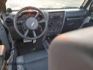 2007 Jeep Wrangler X with VIN 1J4FA24137L107083, listed as a Copart auction lot 88334565 with 156,689 mi miles and Salvage Title. Bid and sale history available at carsss.com. Image 8.