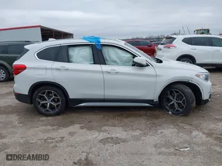 2019 BMW X1 xDrive28i with VIN WBXHT3C51K5L90392, listed as a IAAI auction lot 41571403 with 96,732 mi miles. Bid and sale history available at carsss.com. Image 6.