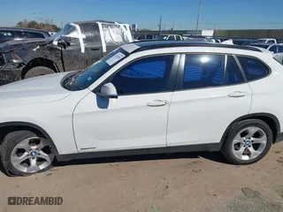 2015 BMW X1 sDrive28i with VIN WBAVM1C51FVZ94433, listed as a IAAI auction lot 41425205 with 148,346 mi miles. Bid and sale history available at carsss.com. Image 14.