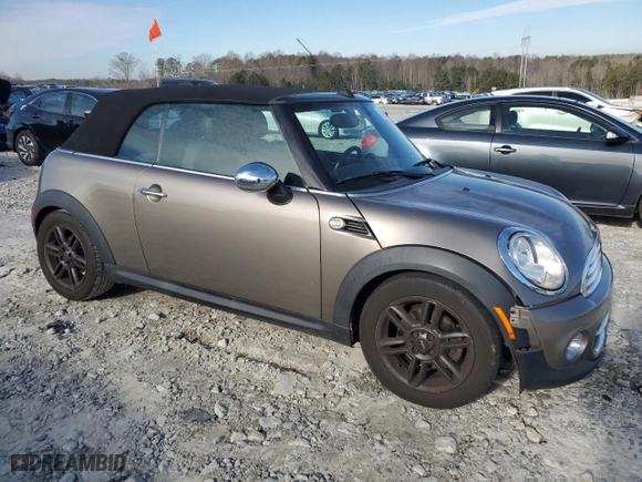 2011 MINI Cooper Convertible with VIN WMWZN3C53BT133576, listed as a Copart auction lot 87543835 with 69,999 mi miles and Salvage Title. Bid and sale history available at carsss.com. Image 4.