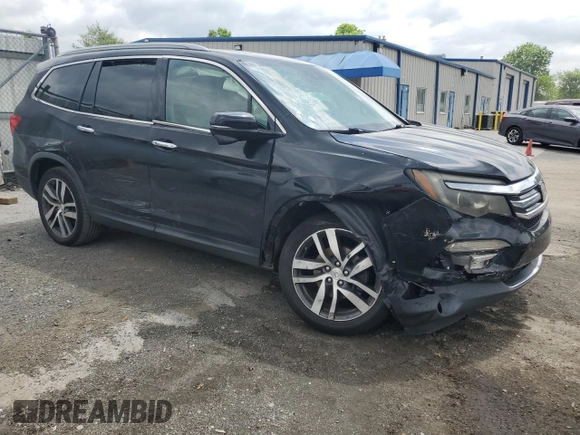 2017 Honda Pilot Touring with VIN 5FNYF6H90HB024321, listed as a Copart auction lot 57459895 with 134,244 mi miles and Salvage title. Bid and sale history available at DreamBid. Image 4.