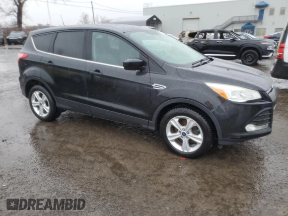 2013 Ford Escape SE with VIN 1FMCU0GXXDUC28067, listed as a Copart auction lot 51427185 with 184,048 mi miles and Salvage Title. Bid and sale history available at carsss.com. Image 4.