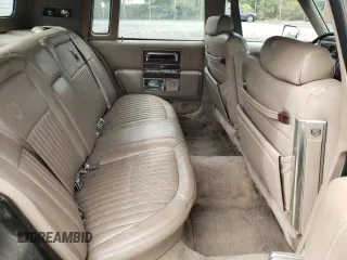 1991 Cadillac Brougham z VIN 1G6DW54EXMR701457, wystawiony jako Copart lot #70194104 z przebiegiem Nie podano mil oraz Nie do naprawy. Historia ofert i sprzedaży dostępna na DreamBid. Obrazek 10.
