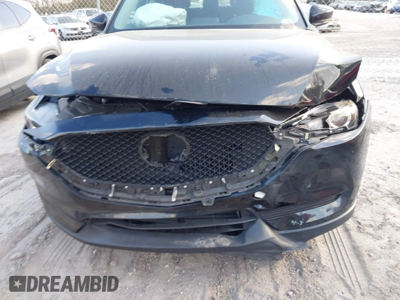 2019 Mazda CX-5 Sport with VIN JM3KFABMXK0693540, listed as a IAAI auction lot 41523569 with 57,895 mi miles and . Bid and sale history available at DreamBid. Image 6.