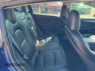 2023 Tesla Model 3 Long Range with VIN 5YJ3E1EB1PF625677, listed as a Copart auction lot 52424245 with 12,817 mi miles and Salvage Title. Bid and sale history available at DreamBid. Image 6.