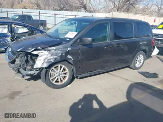2016 Dodge Grand Caravan SXT with VIN 2C4RDGCG2GR265774, listed as a IAAI auction lot 41763444 with 142,700 mi miles. Bid and sale history available at carsss.com. Image 2.