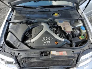 2000 Audi S4 z VIN WAUDD68D7YA179687, wystawiony jako Copart lot #77201694 z przebiegiem 165 118 mil mil oraz Szkody całkowita. Historia ofert i sprzedaży dostępna na DreamBid. Obrazek 11.