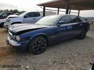 2004 Jaguar XJ with VIN SAJWA71C34SG19800, listed as a Copart auction lot 71877194 with 157,051 mi miles and Salvage Title. Bid and sale history available at carsss.com. Image 1.