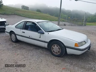 1990 Ford Thunderbird z VIN 1FAPP604XLH213209, wystawiony jako IAAI lot #42367380 z przebiegiem 33 382 mil mil oraz . Historia ofert i sprzedaży dostępna na DreamBid. Obrazek 1.