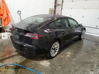 2023 Tesla Model 3 with VIN 5YJ3E1EA8PF451324, listed as a Copart auction lot 88318475 with 74,582 mi miles and Salvage Title. Bid and sale history available at DreamBid. Image 3.