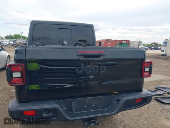 2021 Jeep Gladiator Freedom z VIN 1C6HJTAG4ML586999, wystawiony jako IAAI lot #41911751 z przebiegiem 81 030 mil mil oraz . Historia ofert i sprzedaży dostępna na DreamBid. Obrazek 16.
