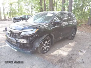 2019 Honda Pilot Touring 7-Passenger with VIN 5FNYF6H60KB030990, listed as a IAAI auction lot 42160762 with 68,807 mi miles and . Bid and sale history available at DreamBid. Image 2.