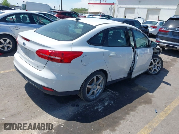 2017 Ford Focus SE with VIN 1FADP3F24HL232527, listed as a IAAI auction lot 42110702 with 95,327 mi miles and . Bid and sale history available at DreamBid. Image 4.