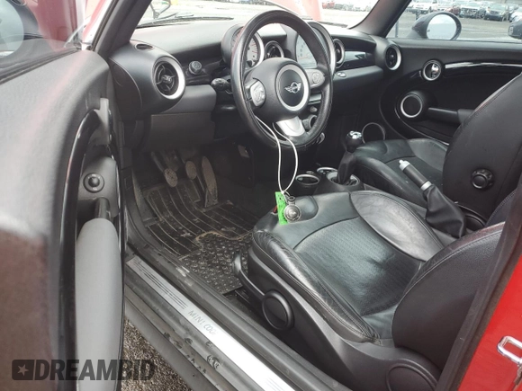 2009 MINI Hardtop with VIN WMWMF33509TU73771, listed as a Copart auction lot 51156025 with 119,622 mi miles and Salvage Title. Bid and sale history available at DreamBid. Image 8.