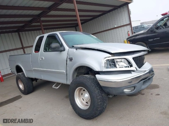 2000 Ford F-150 XL with VIN 1FTRX18L9YKA05396, listed as a IAAI auction lot 41637310 with 234,555 mi miles. Bid and sale history available at carsss.com. Image 13.