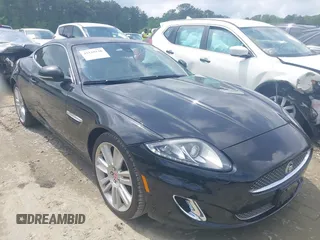 2012 Jaguar XK with VIN SAJWA4FB8CLB47049, listed as a IAAI auction lot 42118136 with 60,953 mi miles. Bid and sale history available at carsss.com. Image 1.