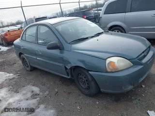 2003 Kia Rio with VIN KNADC125336231562, listed as a IAAI auction lot 41386659 with 87,965 mi miles. Bid and sale history available at carsss.com. Image 1.